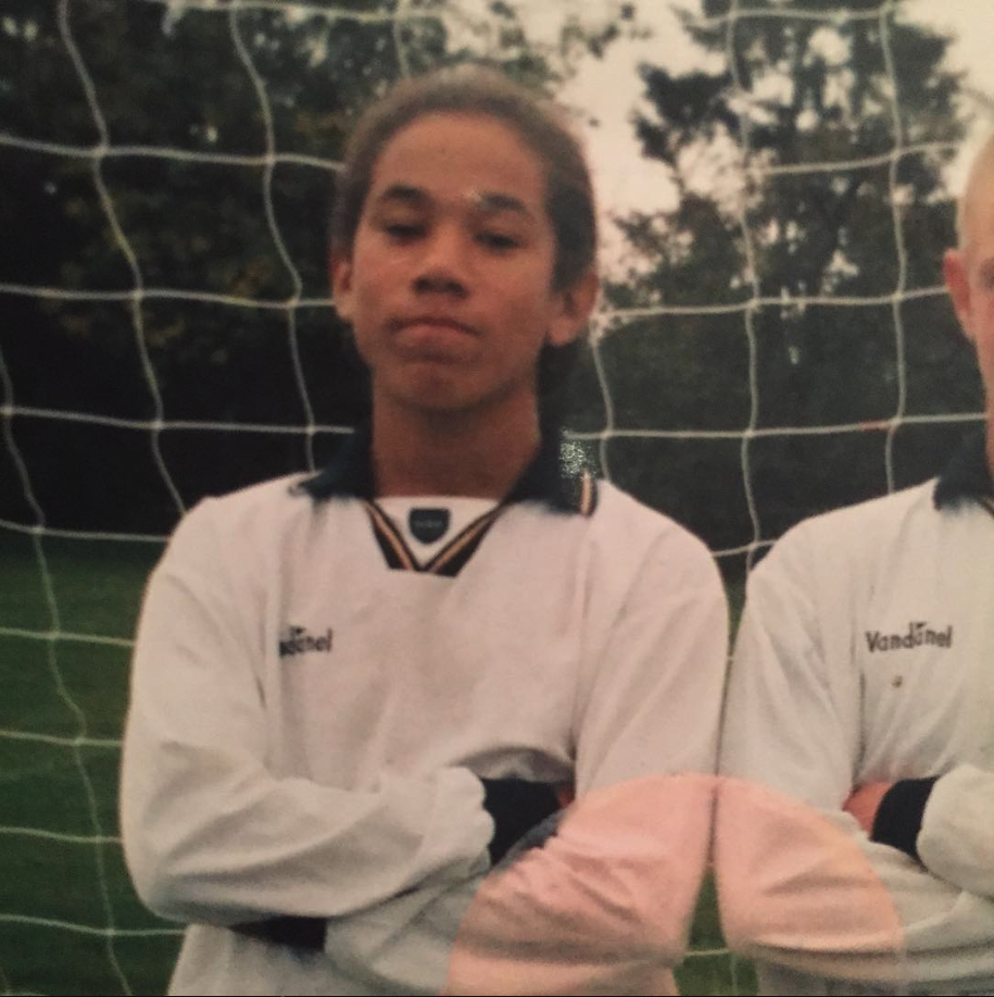 Young Sean Scannell in white Vandanel kit, arms crossed, on the school pitch