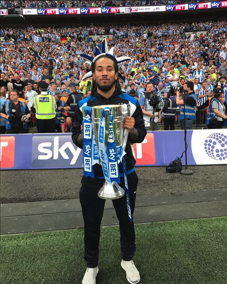 Sean Scannell holding the Sky Bet Championship play-off trophy at Wembley